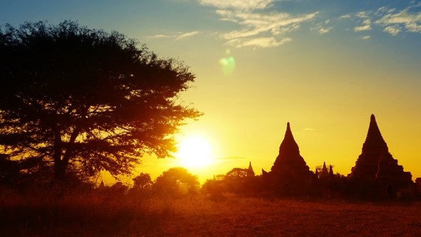 Silhouette of Temples and Tree in Bagan at Sunset alt