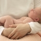 Happy Mother Lulls Her Newborn Baby in Her Arms - VideoHive Item for Sale