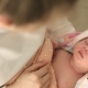 Sleeping Newborn Baby in the Arms of Mother in the Maternity Ward - VideoHive Item for Sale