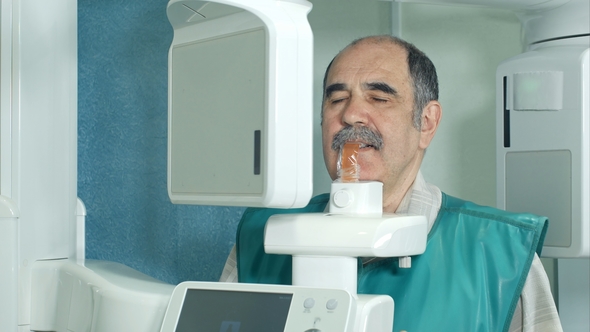 Senior Patient Doing Examination of Teeth By Using Panoramic and Cephalometric X-Ray Scanner