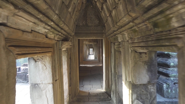 Walking in Corridor of Temple in Angkor Wat