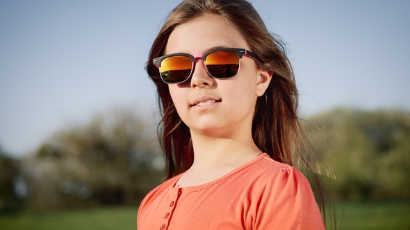 Portrait of a Girl in Sun Glasses at Sunset
