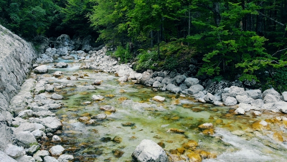 Fresh Clear Water Is Flowing From the Spring Down the Stones