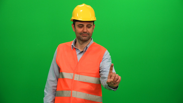 Engineer Man Touching Virtual Monitor on Green Screen