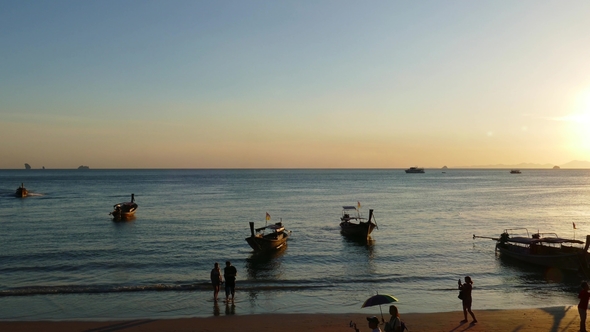 Long Tail Boats on Ao Nang Beach at Sunset