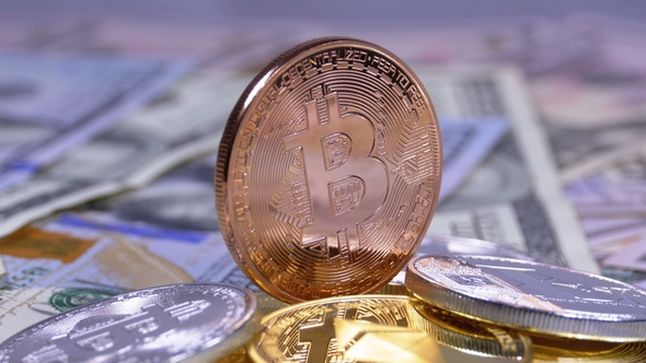 Bronze Bitcoin Coin, BTC and Bills of Dollars Are Rotating