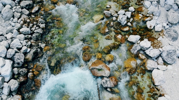 Top View of Water Flow Bathing Rocks at the Bottom