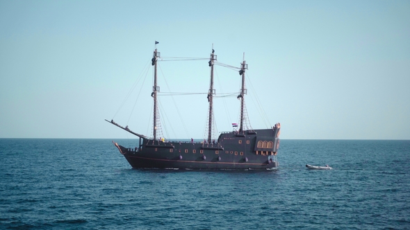 A Pirate Sailboat in the Blue Waters of the Ocean