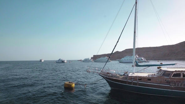 Sailboat Moored in a Bay at Sunset