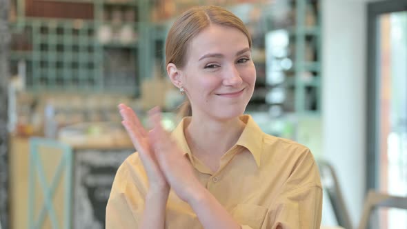 Portrait of Excited Young Woman Clapping, Applauding