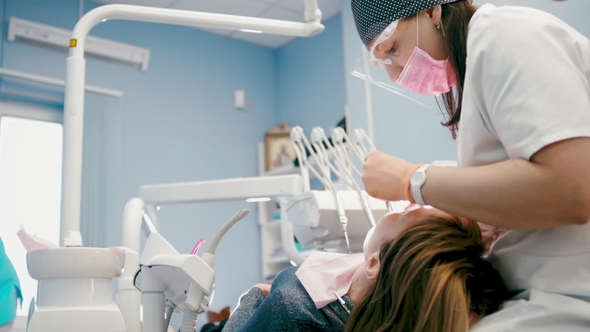 Woman Having A Teeth Check Up At Dentist's Surgery