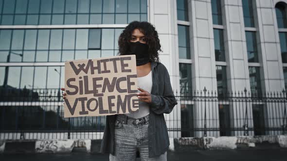 Afroamerican Lady in Black Bandana on Face