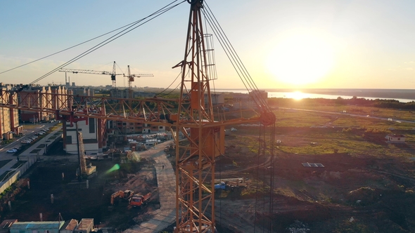 Building Equipment on a Construction Site. Construction Site At Sunset  Silhouette