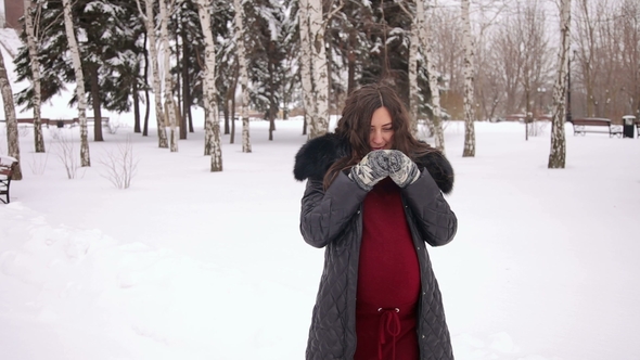 Pregnant Girl Walks in a Winter and Drinks Hot Tea