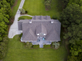 Aerial view of large home with new roof on beautiful property. - PhotoDune Item for Sale