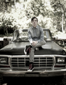 Portrait of young man sitting on old pickup truck - PhotoDune Item for Sale