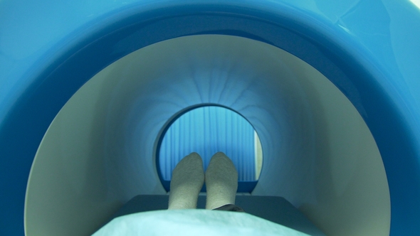 A Patient Moving Into Mri Scan Machine