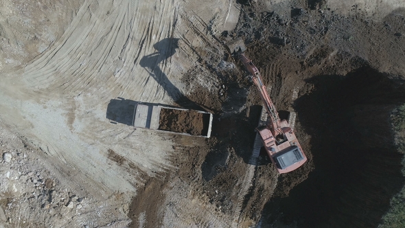 Loaded Lorry Leaves the Excavator