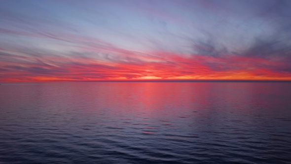 Sunset Flight Over the Sea