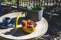Drink and fruit on a table in the garden. - PhotoDune Item for Sale