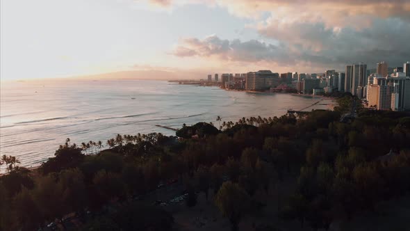 Aerial drone footage of Honolulu, Hawaii. Beautiful real estate, buildings in the city. Palm trees