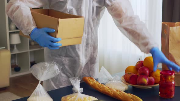 Volunteer Putting Food in Box