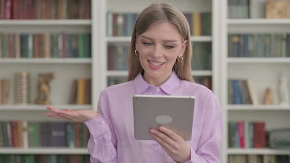 Portrait of Video Call on Tablet By Woman in Office