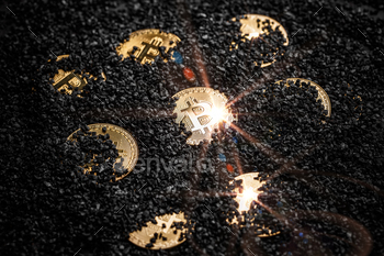 olden coin hidden in black carbon