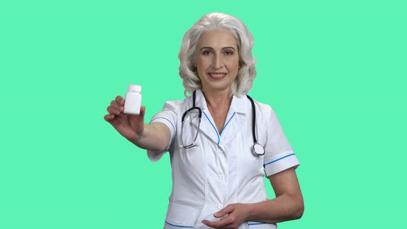 Doctor Woman Showing Pills and Thumb Up.