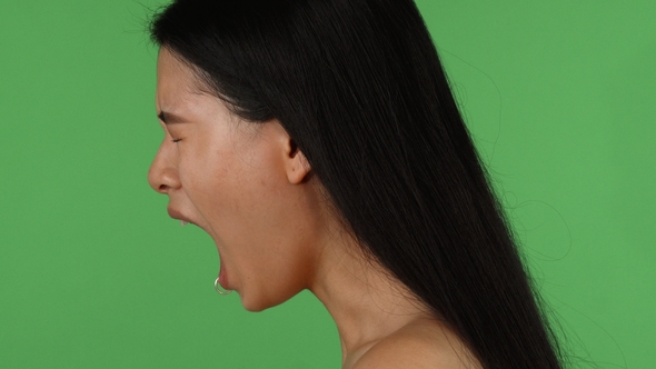 Asian Depressed or Angry Woman Screaming on Chromakey