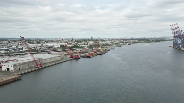 Aerial drone shot of Elizabeth New Jersey Seaport on a cloudy day.