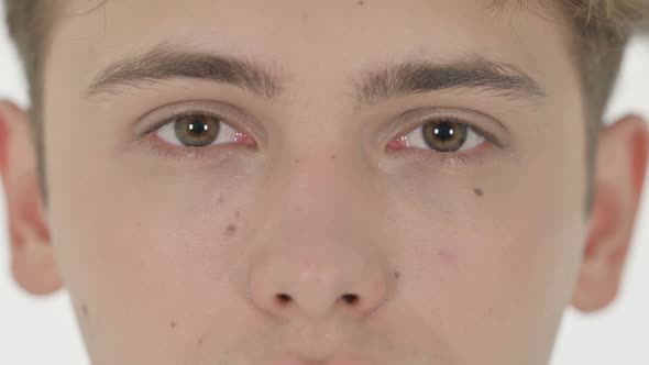 Close Up of Blinking Eyes of Young Man