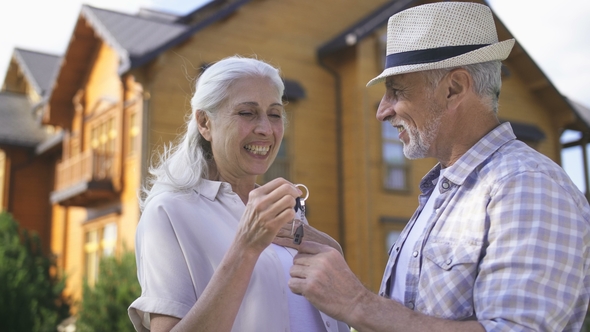 Portrait of Aged Couple with House Keys