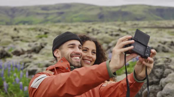 Loving Couple Smiling For Camera Ain Icelandic Landscape