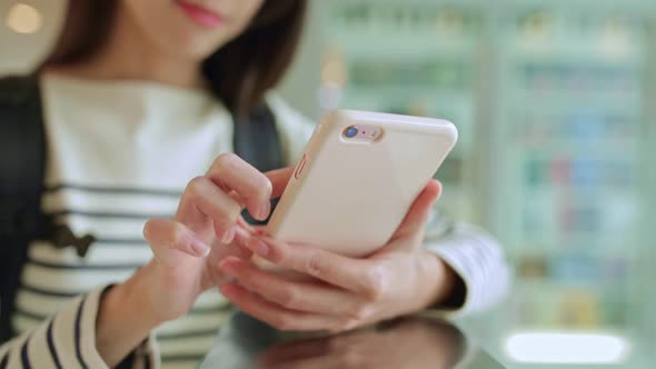 Woman using cellphone for browsing online 