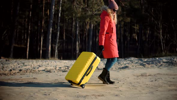 Female Leaves After Family Quarrel. Tourist Travelling Mood. Walking With Yellow Travel Bag