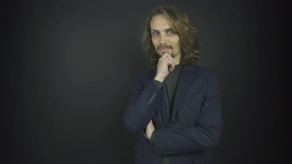 Handsome Guy in Grey Classic Jacket Poses for Photo Shoot