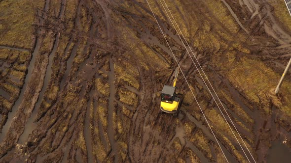 excavator drives to work in sun power plant