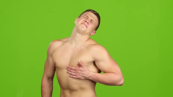 Handsome Man Suffers From Pain in Breast Muscle, Green Screen