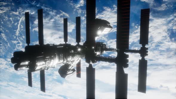 International Space Station in Outer Space Over the Planet Earth alt