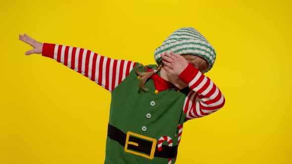 Kid Girl in Christmas Elf Santa Helper Costume Dancing Performing Dab Dance Internet Meme Gesture