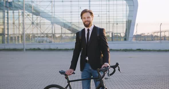 Man which Leaning on His Bike and Working on Imaginary Screen in Virtual Reality Headset