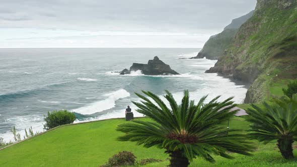 Tourist Observes Fascinating Vista of the Atlantic Ocean