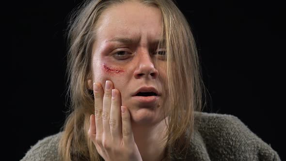 Abused Woman Crying Hard, Feeling Desperate and Defenseless, Spousal Abuse