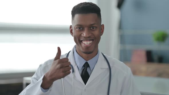 Portrait of African Doctor showing Thumbs Up Sign