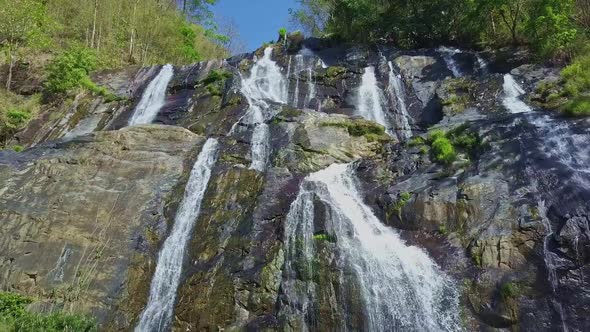 Close Wide Panorama Waterfall Among Tropical Forest