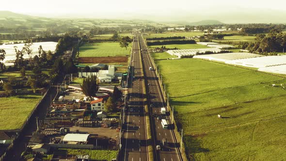 Aerial view over a highway with cars passing by in South America