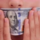 A person who uses the US dollar as the mask, and the mask coronavirus, - VideoHive Item for Sale