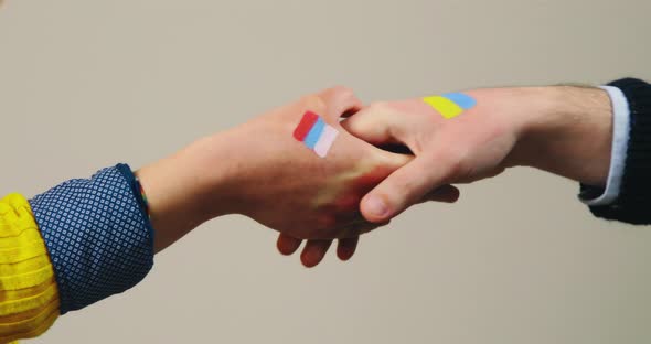 Handshake with Ukrainian White in Background