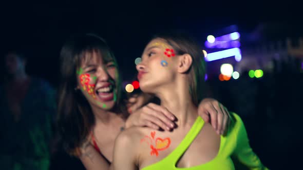 4K Group of Asian woman enjoy full moon beach party and dancing together.